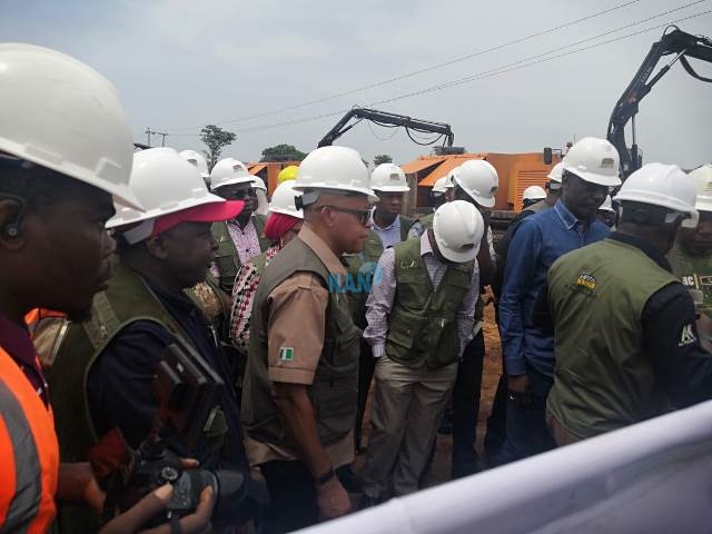 Oilserv chairman, Okwuosa (In brown shirt) assessing the AKK project with NNPC GMD Kyari (In blue jeans shirt) and other officials